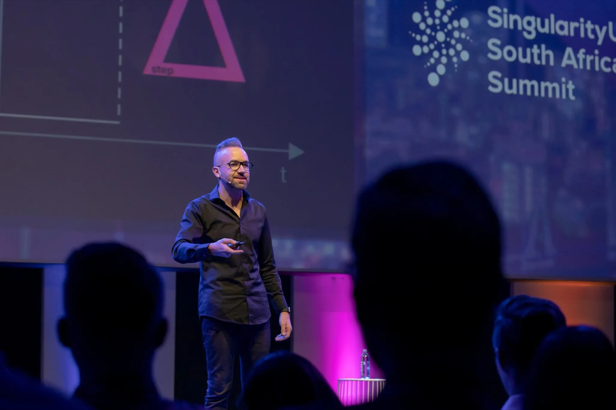 Adam Pantanowitz delivering Step Change at the Singularity University Summit, 2019