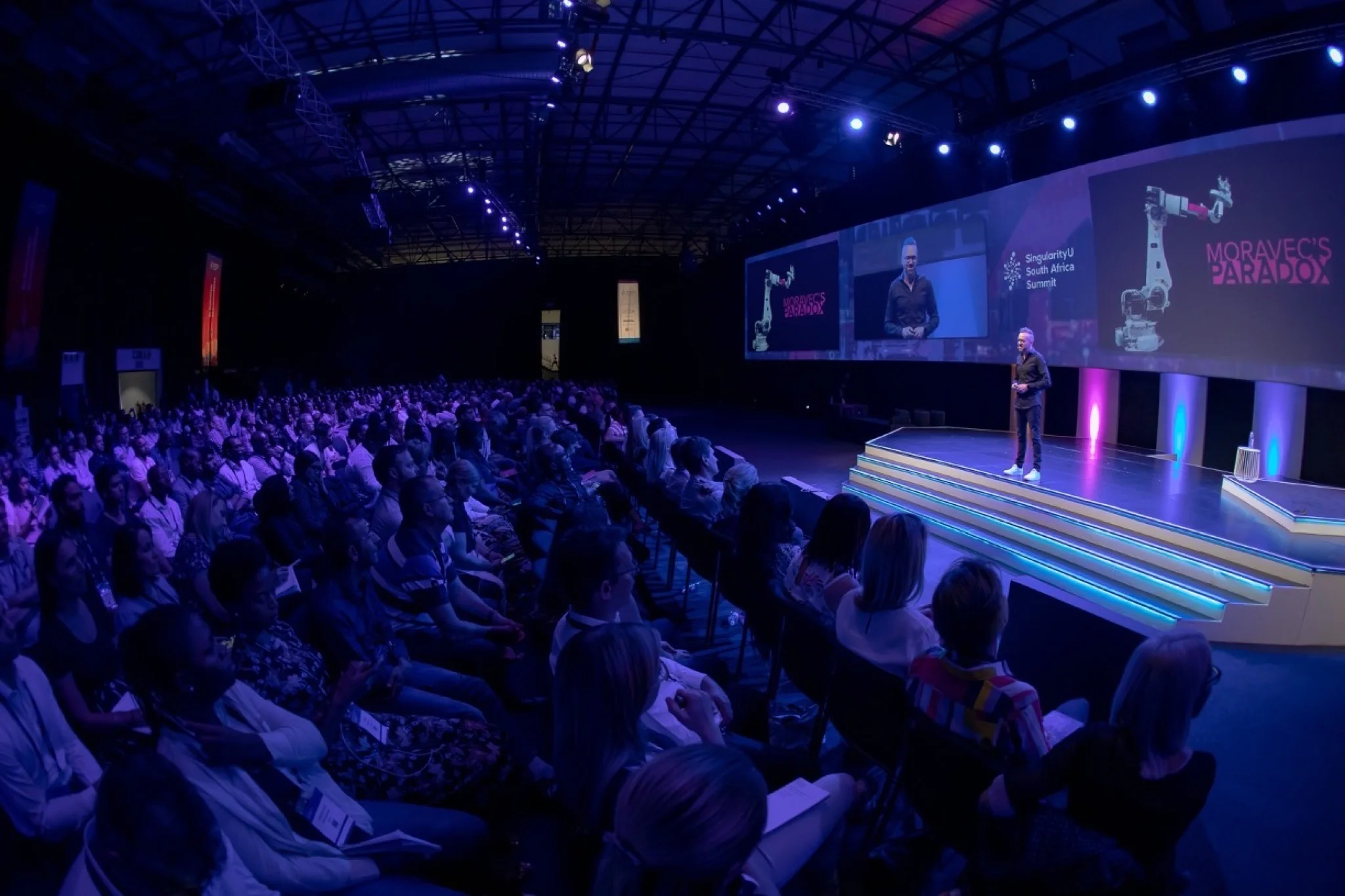 Adam Pantanowitz delivering Step Change at the Singularity University Summit, 2019