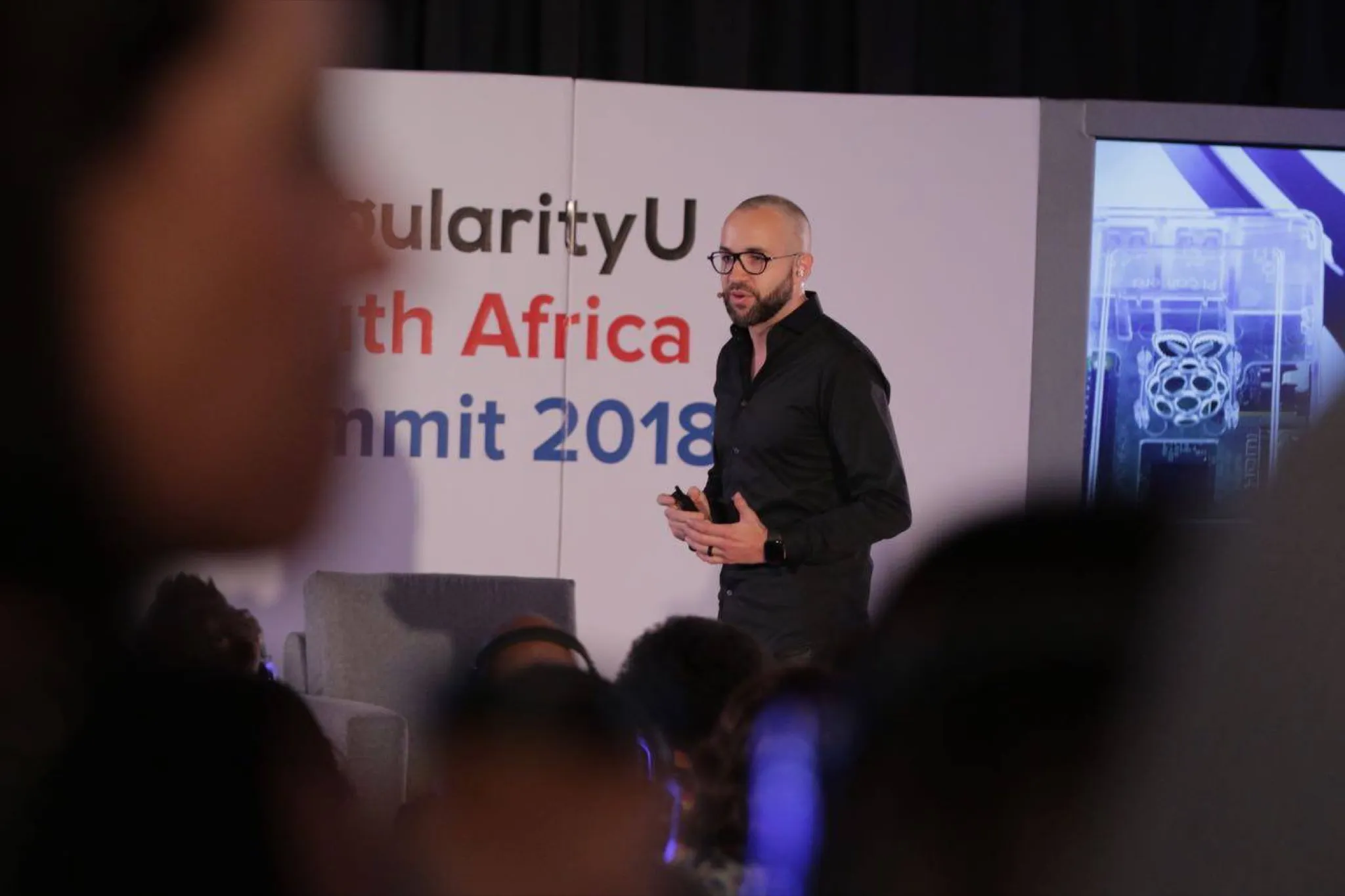 Adam Pantanowitz delivering Hacking Humans at the Singularity Summit, 2018